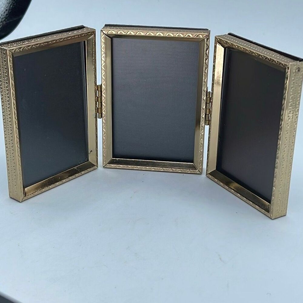 Vintage tri-fold 3.5” X 2.5” gold tone picture frame.